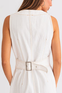 Model wearing a trendy white mini denim dress from Boho Bum Island Boutique.