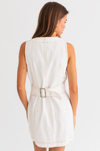 Model wearing a trendy white mini denim dress from Boho Bum Island Boutique.