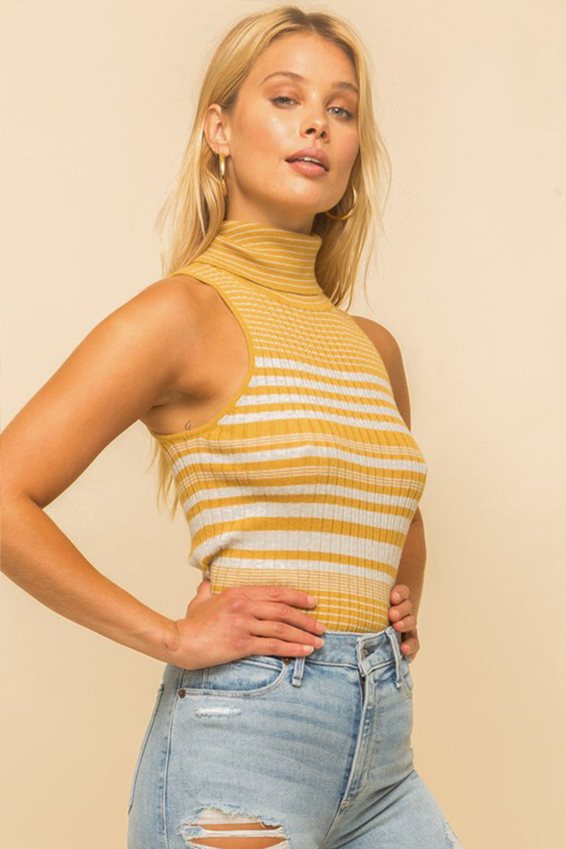 Model wearing a yellow & white striped turtle neck tank top from Boho Bum Island Boutique