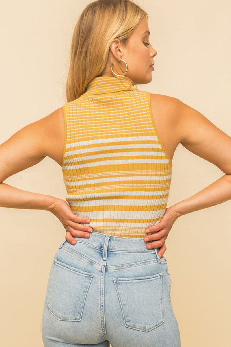 Model wearing a yellow & white striped turtle neck tank top from Boho Bum Island Boutique