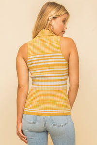 Model wearing a yellow & white striped turtle neck tank top from Boho Bum Island Boutique