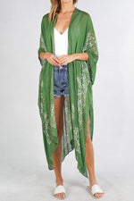 Model wearing a green scarf printed kimono from Boho Bum Island Boutique