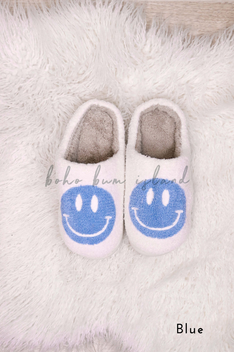 Smiley face emoji slippers in purple, blue, aqua and pink from Boho Bum Island Boutique. 