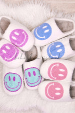 Smiley face emoji slippers in purple, blue, aqua and pink from Boho Bum Island Boutique. 